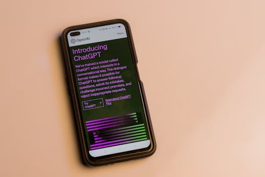 Webpage of ChatGPT, a prototype AI chatbot, is seen on the website of OpenAI, on a smartphone. Examples, capabilities, and limitations are shown.