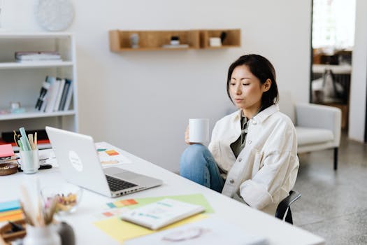 Woman Working on Computer in an Office